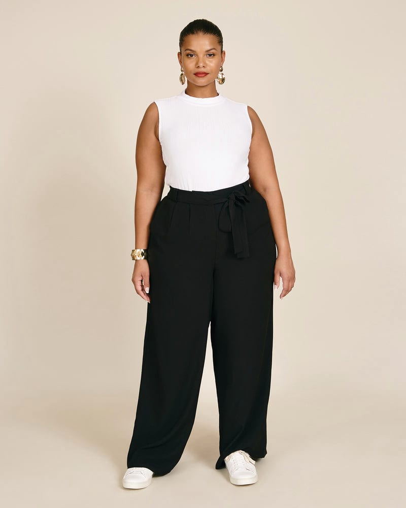 Front of a model wearing a plus size Maya Pant in Black by 11 Honoré Collection. | dia_product_style_image_id:231402